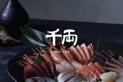 Sen-ryo's logo alongside a background of a plate of sashimi