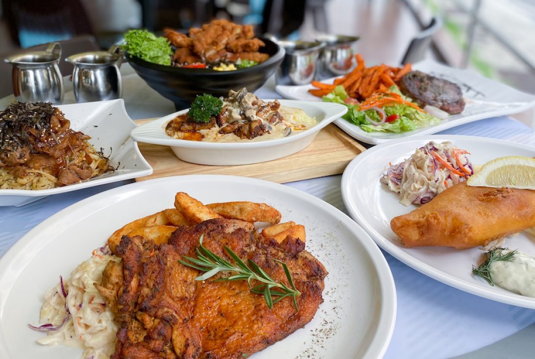 A table full of The Queen's Grill's dishes