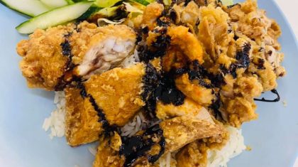 Plate of fried chicken wing rice from victors famous