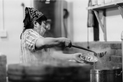 Woman cooking noodles